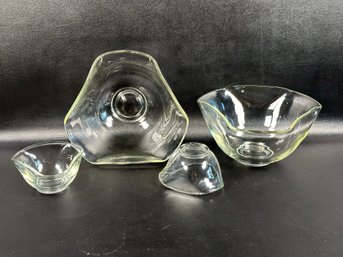 A Set Of Triangular Bowls In Clear Glass