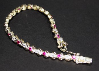 FINE STERLING SILVER LINK BRACELET HAVING WHITE AND RED GEMSTONES 7' LONG