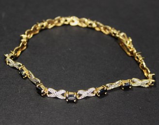 FINE GOLD OVER STERLING SILVER LINK BRACELET HAVING SAPPHIRES AND WHITE GEMSTONES 7 1/4'