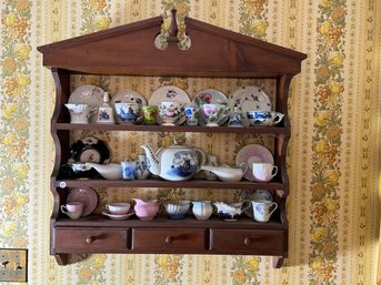 A COUNTRY SHELF WITH ANTIQUE TEA CUPS, INVALIED FEEDERS, ETC.