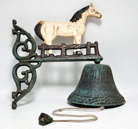 A Vintage Cast Iron Equestrian Themed Bell