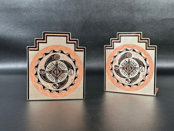 A Pair Of Bookends In Etched Copper With A Southwestern Style