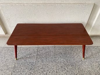 Vintage Laminate Cherry Tone Cocktail Table W// Peg Style Out-turned Legs & Brass Capped Feet
