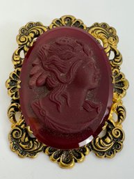 VINTAGE BRASS AND DEEP RED GLASS CAMEO BROOCH