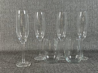 Four Champagne Flutes & Two Stemless Wines In Clear Glass