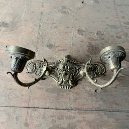 A Cast Metal Wall Sconce