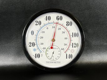 A Contemporary Household Wall Thermometer With Hygrometer