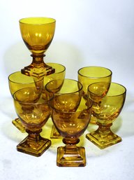 Lot 8 Early Anglo Cut Glass Amber Colored Footed Wine Stems