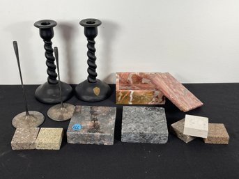 A POLISHED ROSE MARBLE BOX WITH POLISHED GRANITE DISPLAY PLINTHS AND TWO PAIRS CANDLESTICKS