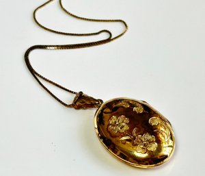 A Gold Plated Spanish Locket With Floral Etchings