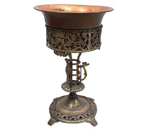 An Antique Plant Stand With Copper Cache Pot