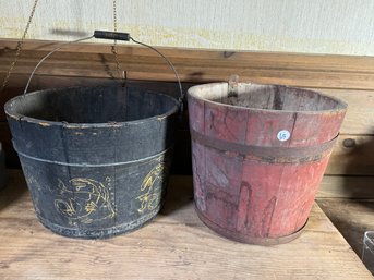 TWO ANTIQUE BUCKETS, ONE BLACK ONE RED