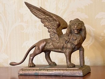 An Antique Brass Griffin Doorstop