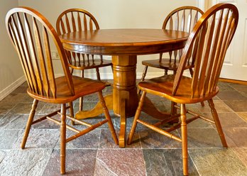 A Classic Golden Oak Extendable Dining Table And Set Of 6 Windsor Chairs