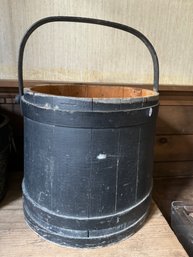 A LARGE ANTIQUE FIRKIN IN BLACK PAINT