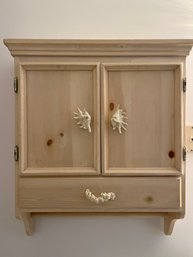 A Wood Wall Mounted Cabinet With Towel Bar And Sea Shell Handles - Bath 1A - Removed & Ready For Pickup
