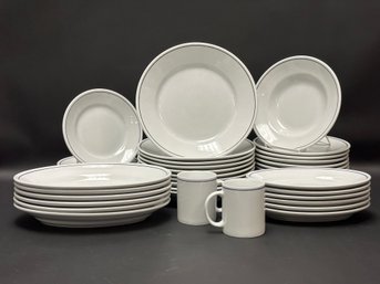 An Assortment Of White Porcelain Dinnerware By Saturnia