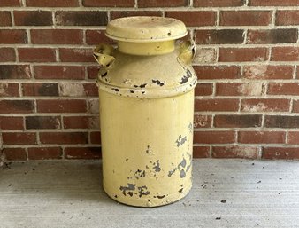 A Rustic Painted Milk Can With A Naturally-Aged Patina