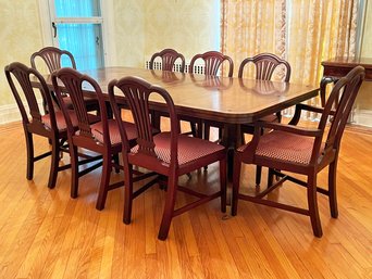 An Antique Banded Mahogany Spindle Based Dining Table With Glass Top And Set Of 8 Chairs