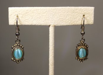 STERLING SILVER PIERCED EARRINGS HAVING OPALESCENT BLUE STONES