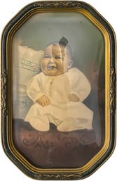 An Antique Convex Glass Frame With Early 20th Century Baby Hand Tinted Photograph