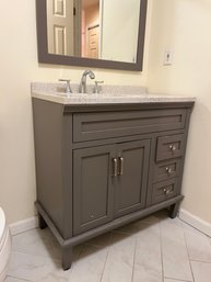 A Wood Vanity With Composite Top Includes Matching Wood Framed Mirror - Bath 2- Removed- Ready For Pickup