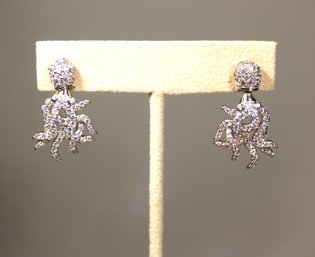 FANCY STERLING SILVER PIERCED 'OCTOPUS' STYTLE EARRINGS HAVING WHITE STONES