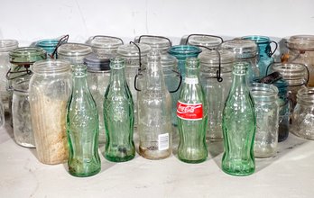 A Collection Of Vintage Bottles And Ball Jars