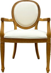 A Carved Oak Arm Chair In Clean Linen Upholstery