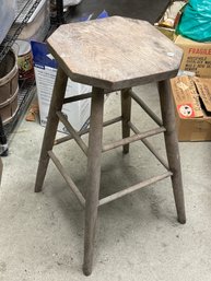 AN OVERSIZED COUNTRY STOOL