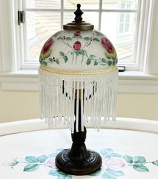 A Vintage Painted Glass And Bronze Tone Accent Lamp With Beaded Shade