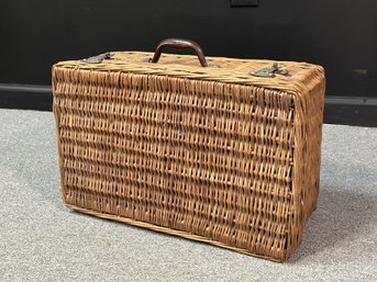 A Vintage Wicker Suitcase, Great For Picnics Or Decorative Storage