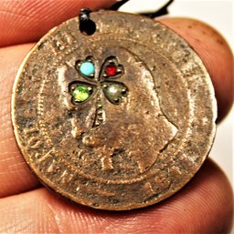 Antique Coin Having Gold Inlay And Precious Stone In The Form Of A Four Leaf Clover