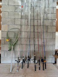 Group Of Fishing Poles And Net