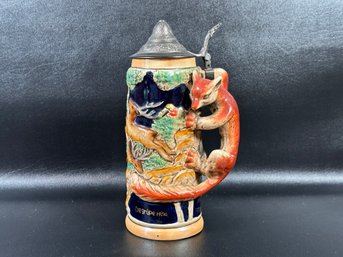 A Whimsical Vintage Beer Stein With A Musical Base