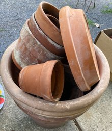 Terra Cotta And Plastic Planters