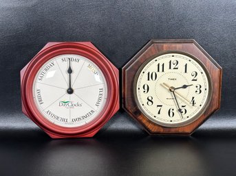 A Pair Of Day & Time Clocks In Octagonal Wood Cases