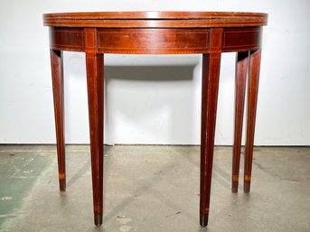 A Vintage Mahogany Demi-Lune Flip Top Console