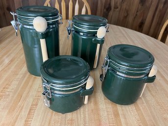 Set Of Four Green Kitchen Cannisters With Wooden Spoons