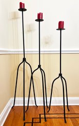 A Trio Of Large Modern Wrought Iron Candle Holders