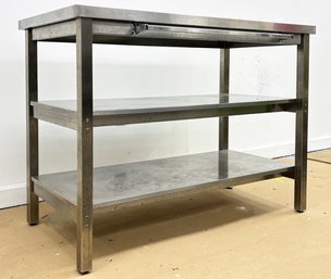 An Industrial Stainless Steel Kitchen Island Or Work Station