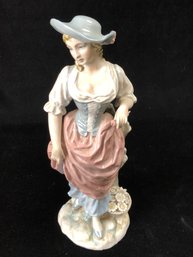 Women In Pink And Blue Dress Figurine