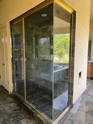 A Gold Finish Metal Frame Plexiglass Shower Enclosure - Primary Bath - Her