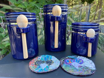 Trio Of Canisters With Folk Art Mini Trivets