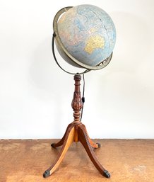 A Vintage Globe With Turned Wood Base