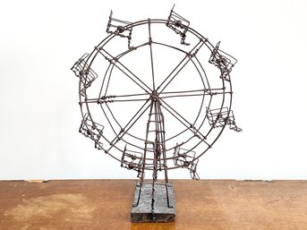 A Wire Sculpture Of A Ferris Wheel