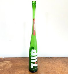 A Vintage Blown Glass 7-uP Bottle