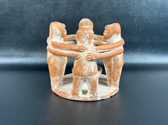 A Traditional Circle Of Friends Votive Holder In Terracotta