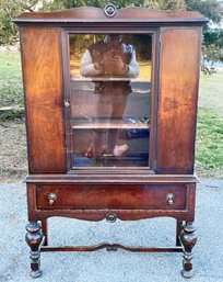 An Antique Flame Mahogany China Cabinet With Glass Doors