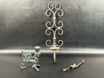 A Grouping Of Decorative Vintage Items In Wrought Iron: Candle Sconce, Griffin Candle Holder & Monkey Hook